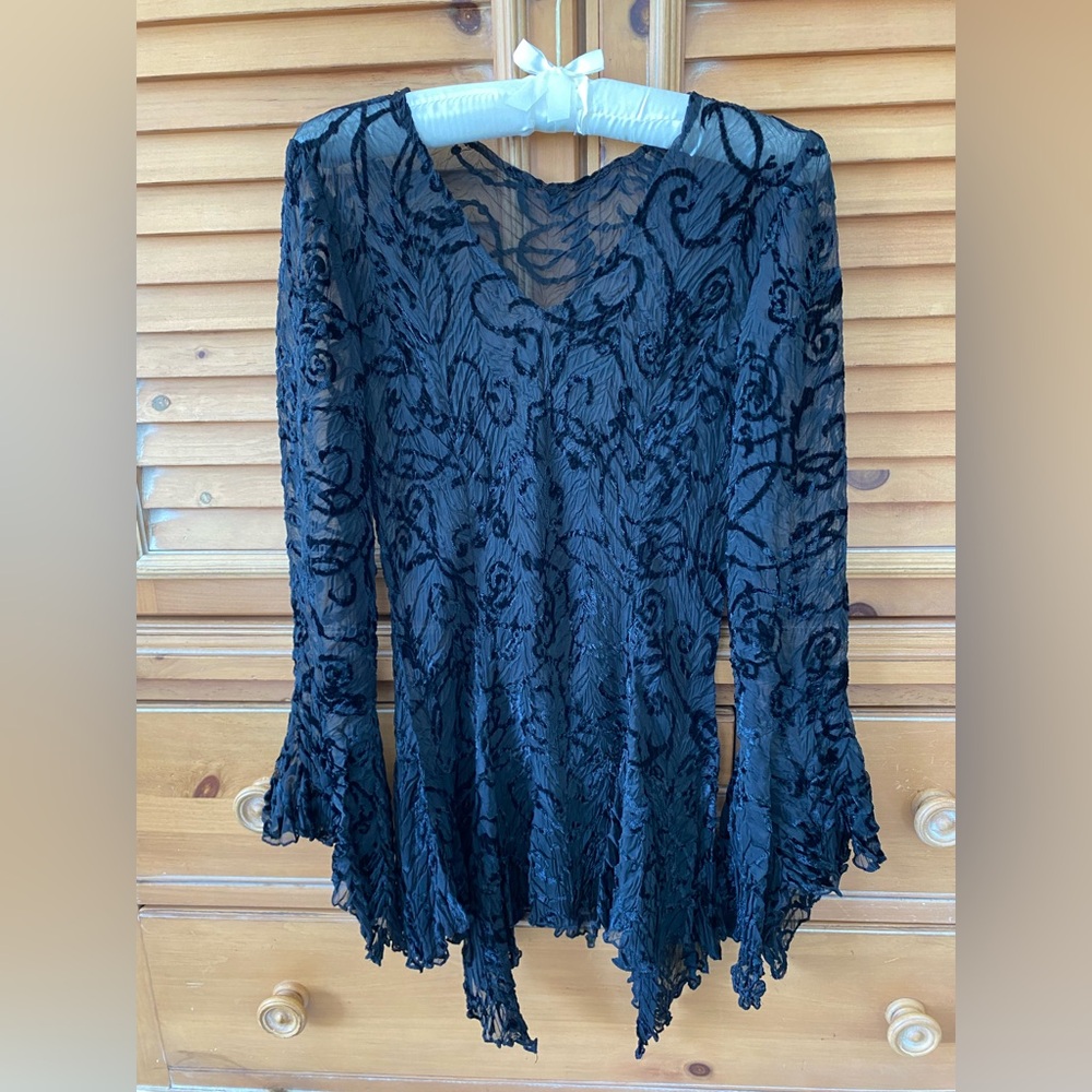 Gorgeous chiffon and velvet top with kerchief long sleeve cuffs and hem.